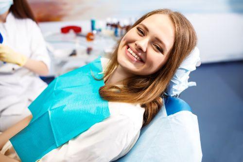 a woman smiling after a routine dental treatment in Columbia, Md